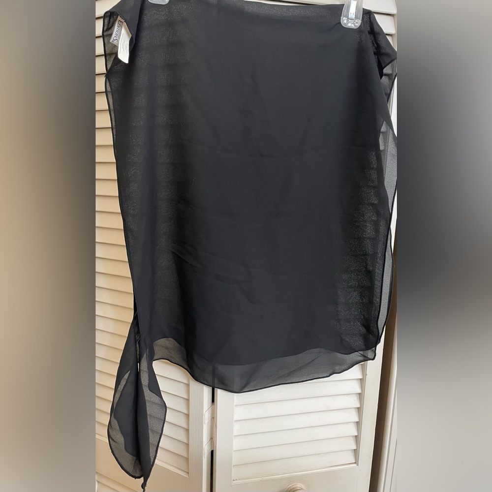 Women’s black scarf/shawl. 100% polyester. 44” X 18”.